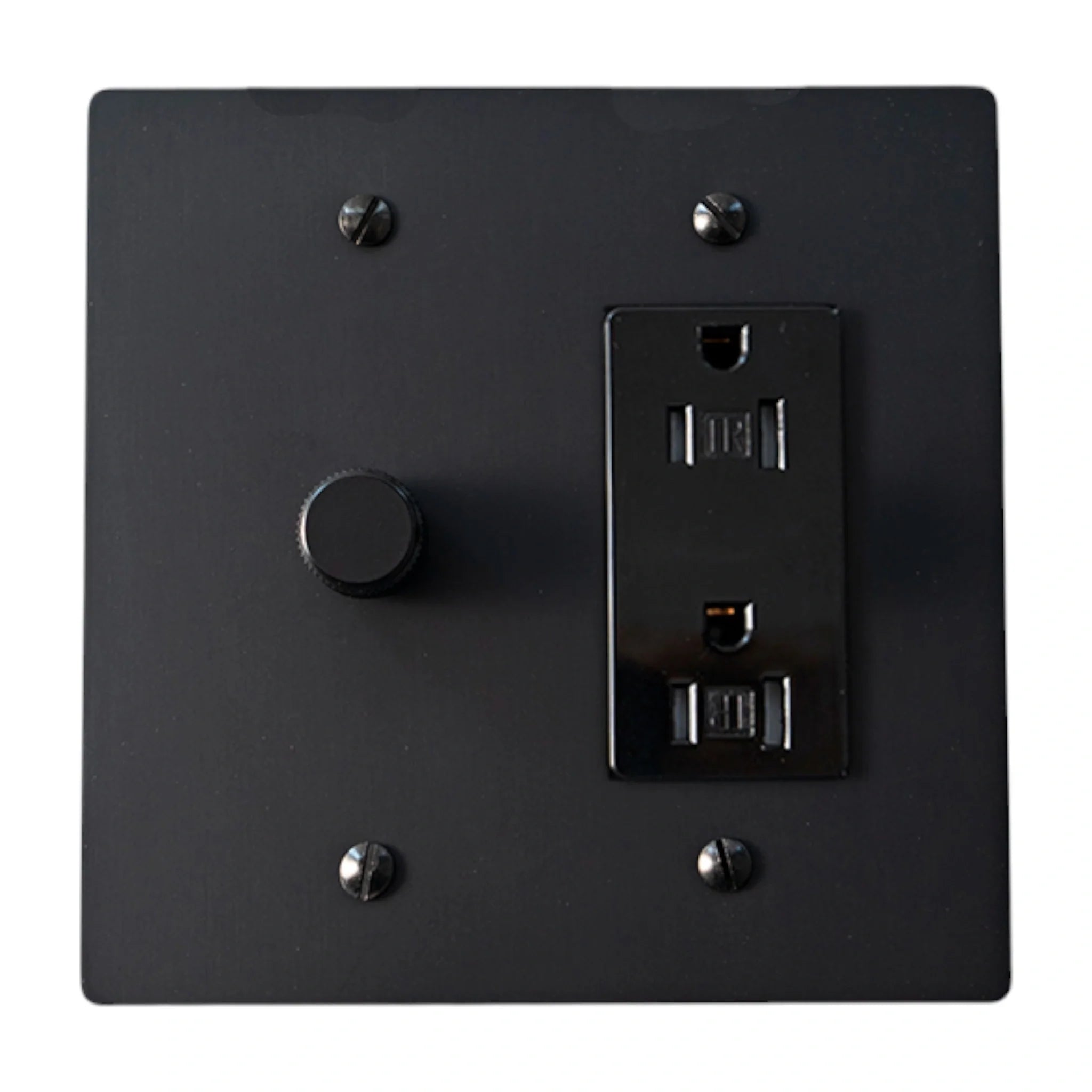 Black wall switch and socket on a white background
