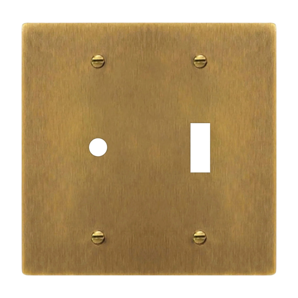 2-gang solid brass dimmer and toggle wall plate in antique brass hand-brushed finish, rotary plus toggle opening