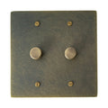 2 gang Bronze brass dimmer switch plate with antique knob on a white background
