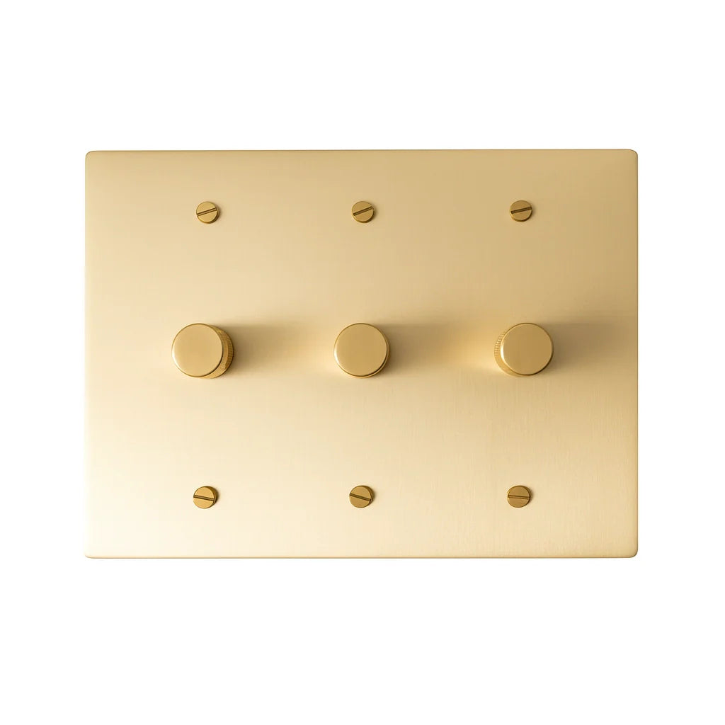 Three gang solid brass dimmer switch with smooth knobs and minimalist brushed finish.