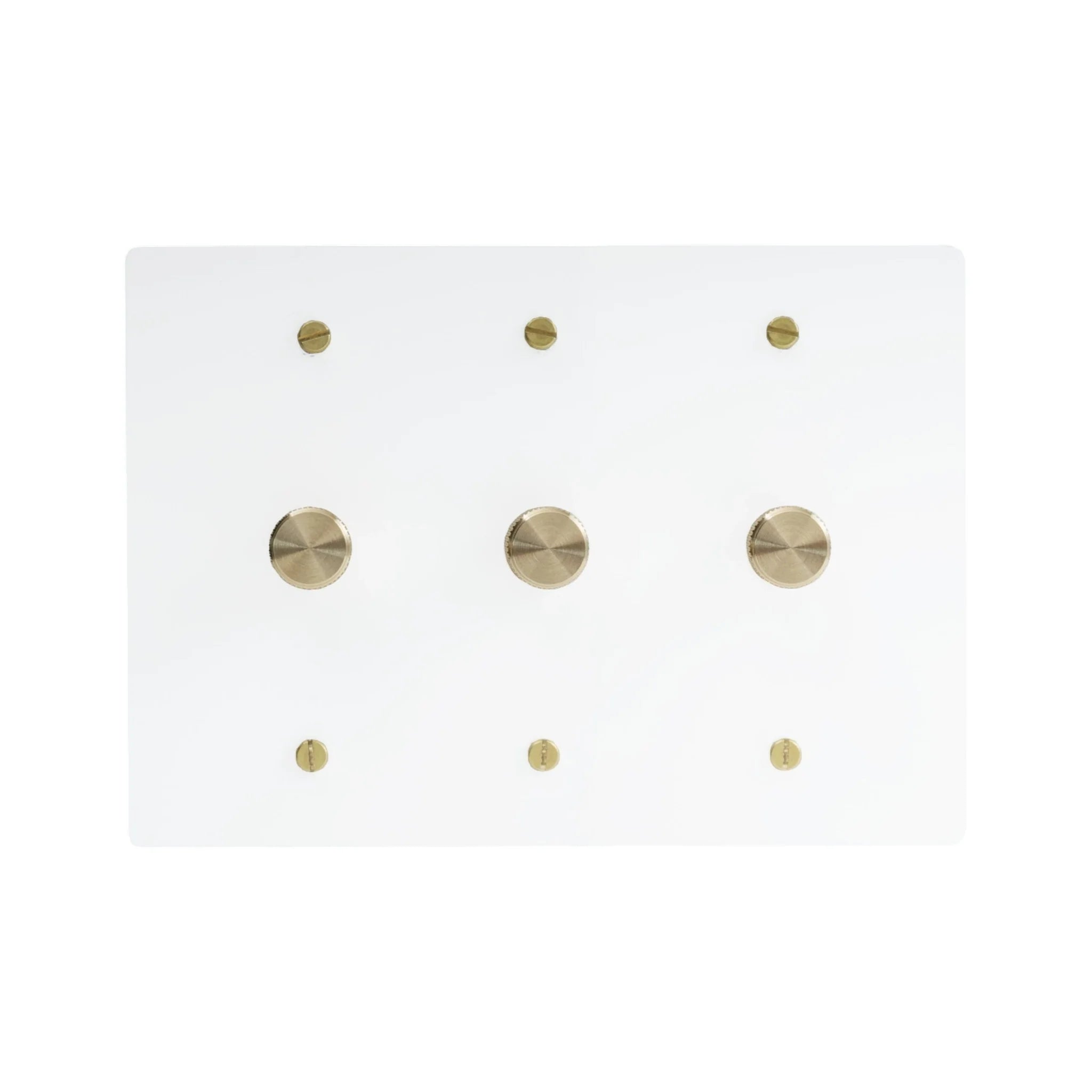Three gang white dimmer switch with brushed brass control knobs and smooth white finish.