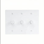 White light switch panel with multiple switches on a white background