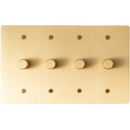 Four gang brushed brass dimmer light switch with rotary control knobs on rectangular plate.