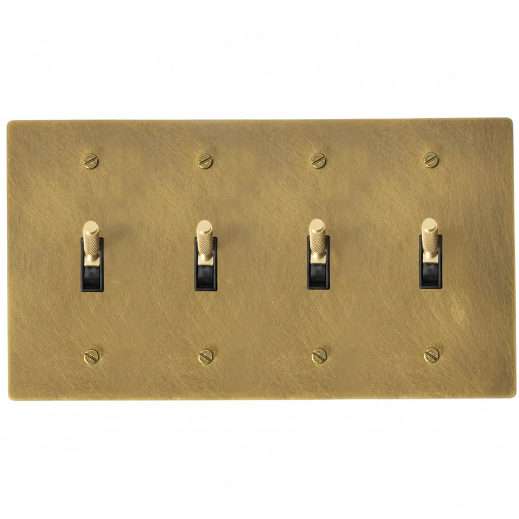 4-gang knurled toggle light switch plate in antique brass, hand-brushed, front view