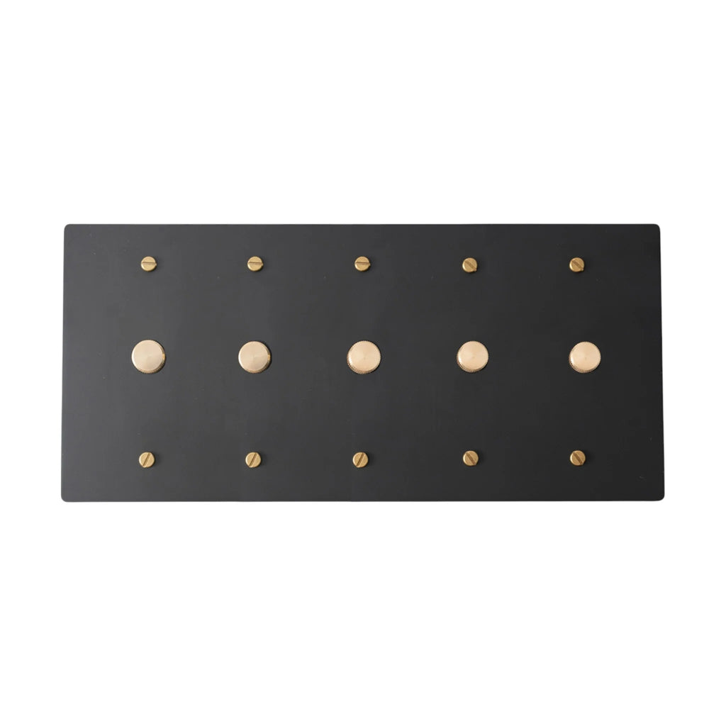 Black 5 gang rotary dimmer with gold brass knobs on a white background