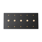 Black 5 gang rotary dimmer with gold brass knobs on a white background