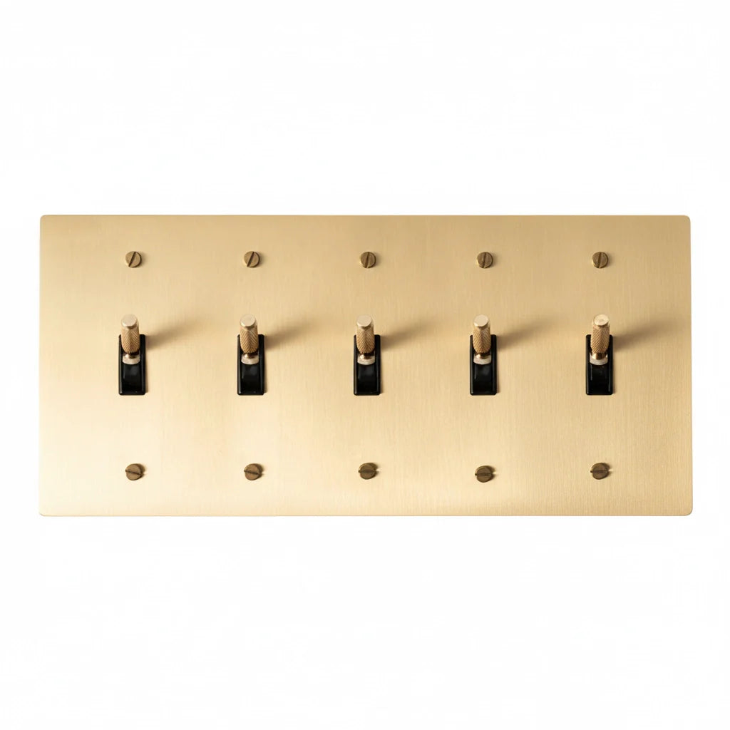5-gang knurled toggle light switch plate in satin brass, front view