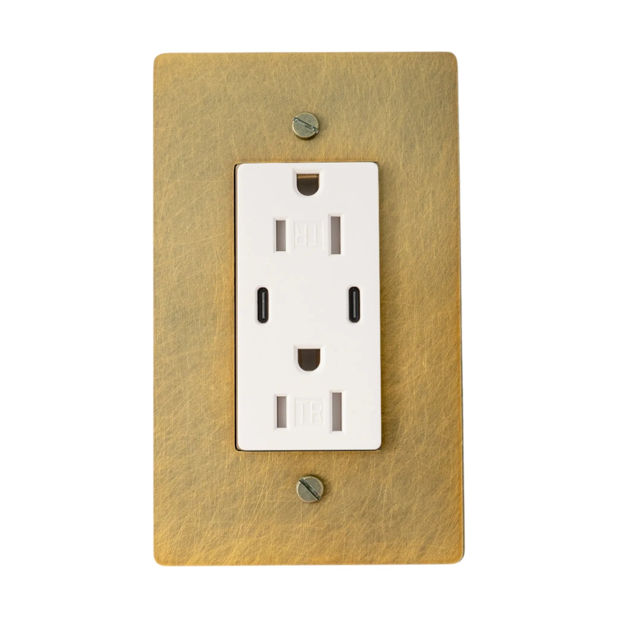 White electrical outlet on a antique brushed brass wall plate with screws