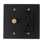 Black wall plate with a single electrical outlet and round dimmer switch on a white background