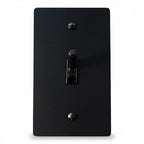 Black light switch cover with a single toggle on a white background