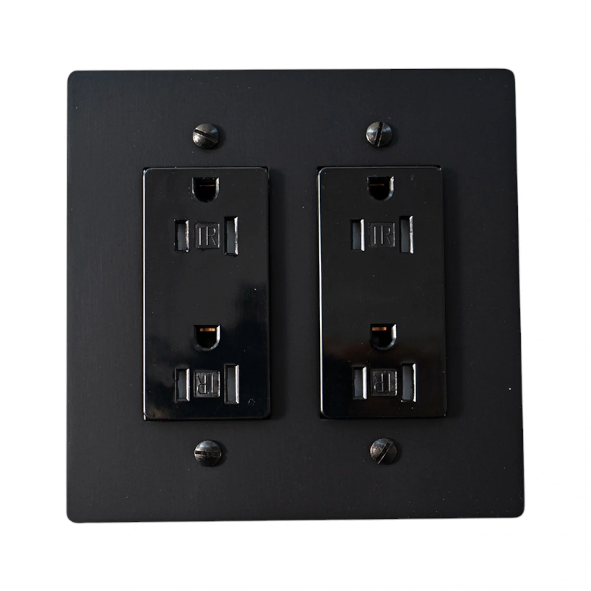 Black electrical outlet cover with two sockets on a white background
